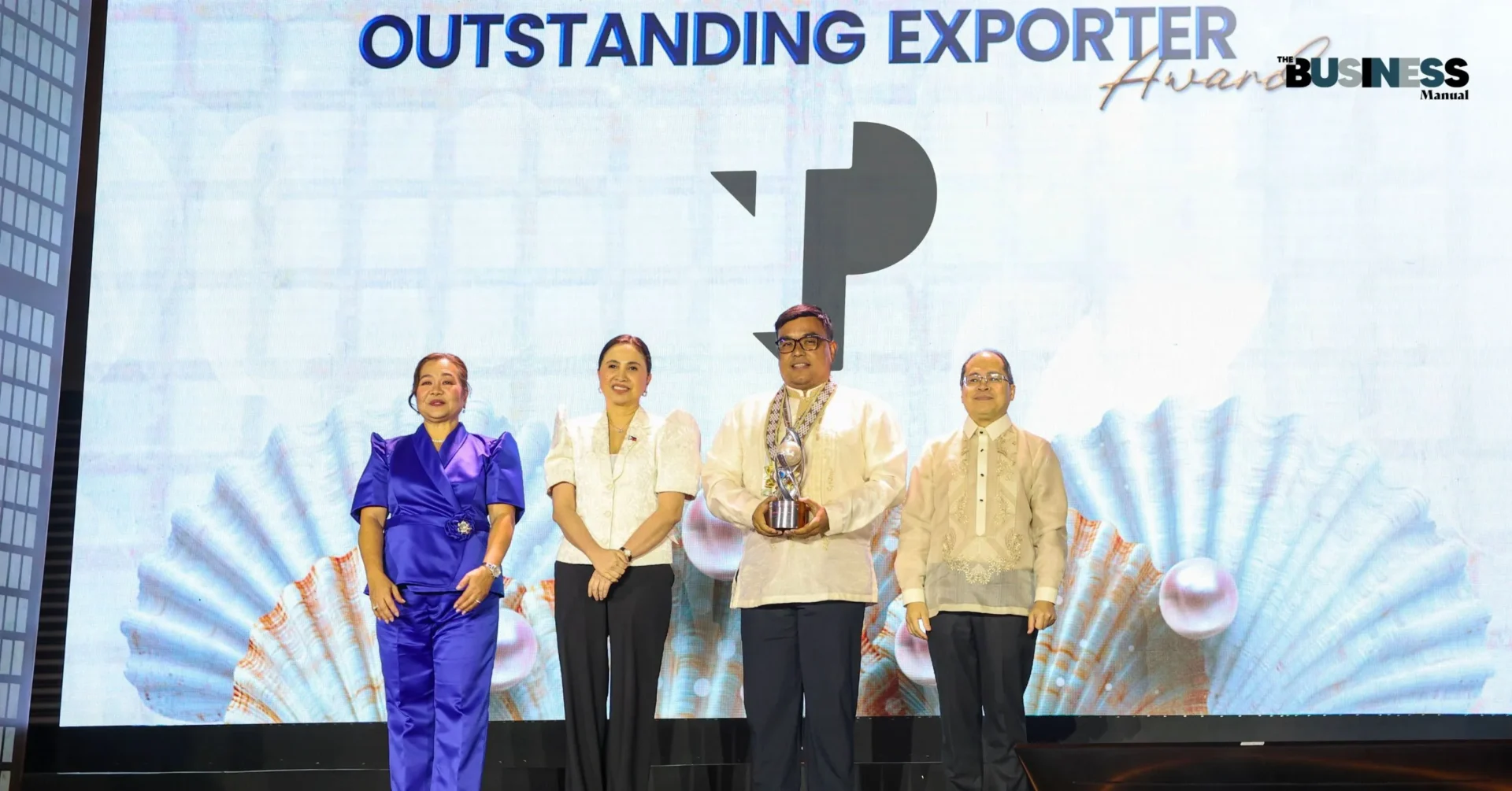 TP in the Philippines is an Outstanding Exporter Awardee at the 2025 PEZA Awards held in Manila. In the photo receiving the award for TP was TP Senior Director Ariel Carpio (third from left). With him are, from left, PEZA Deputy Director Vivian Santos, DTI Secretary Cristina Roque, and PEZA Director General Tereso Panga.